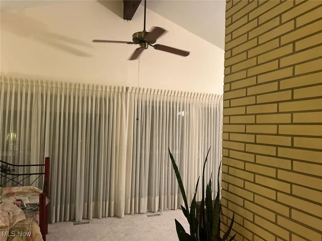 View of living area with  ceiling fan