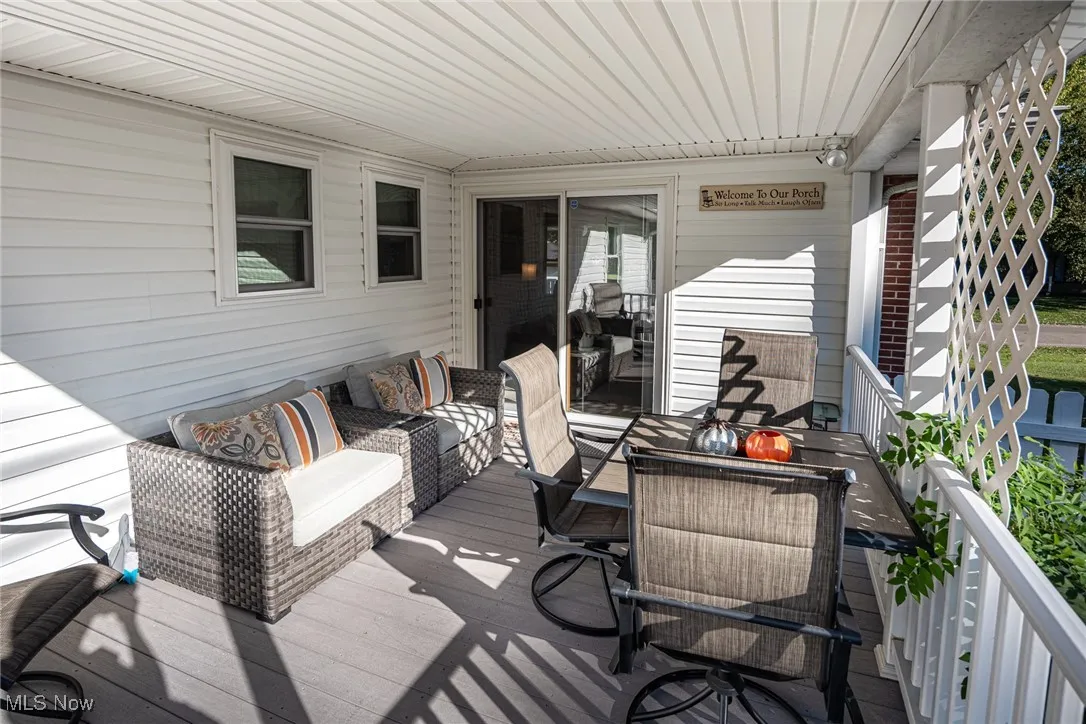 Wooden terrace featuring an outdoor hangout area