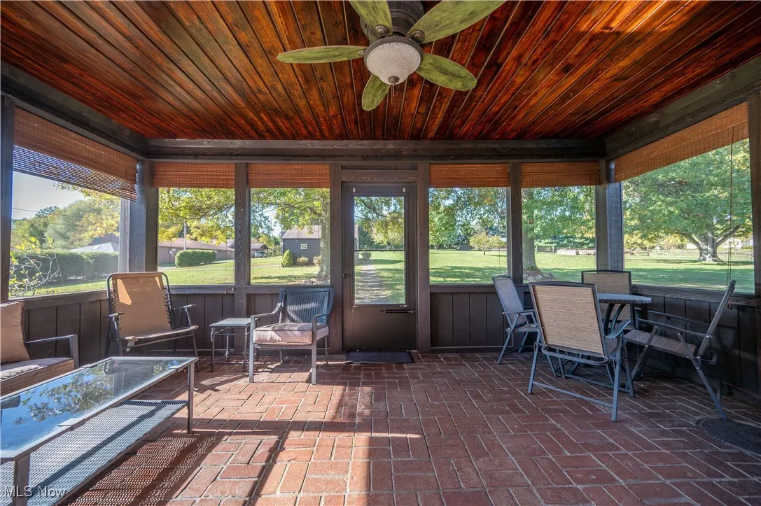 Screen porch over looks side yard