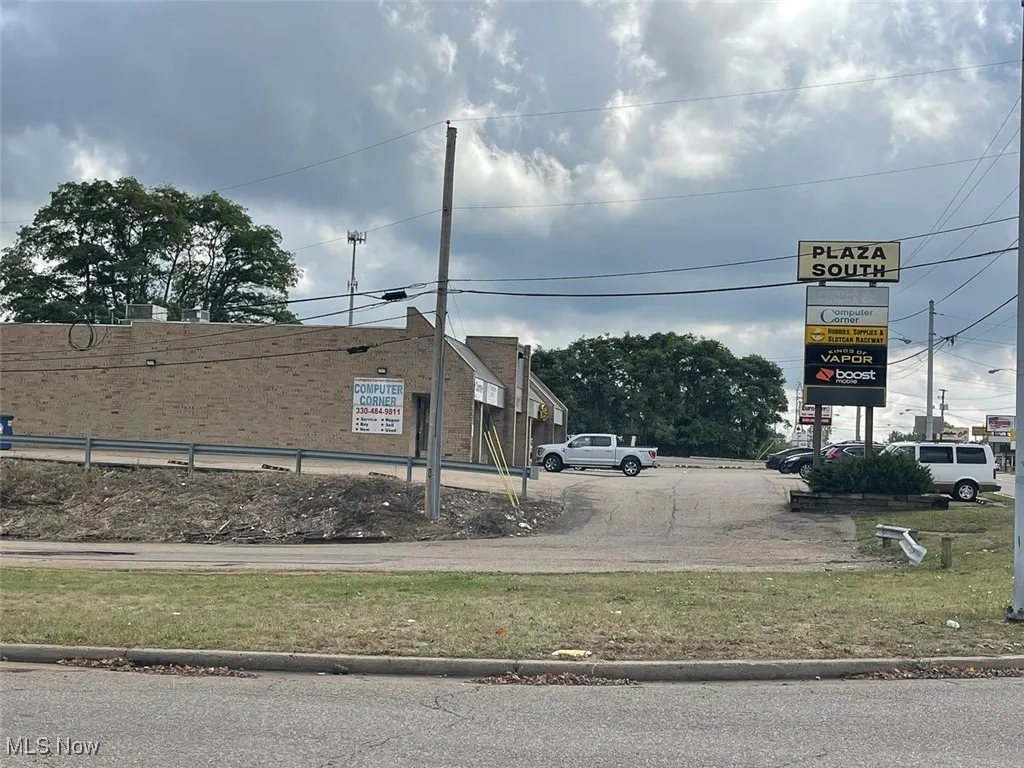 View of asphalt street featuring curbs