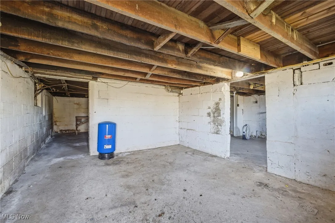 Below grade area featuring a water pressure tank