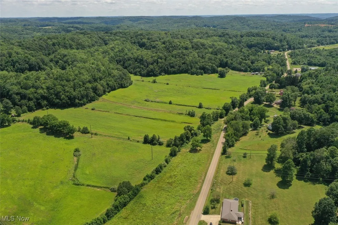 Aerial view of sparsely populated area featuring a pastoral area