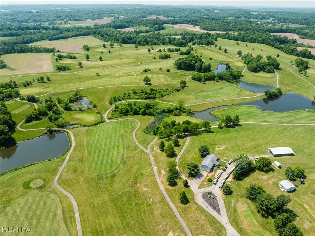 Aerial overview of property's location with a large body of water