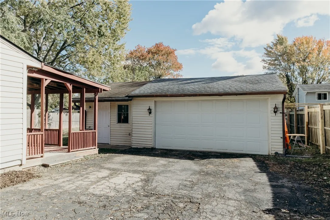Garage with asphalt driveway
