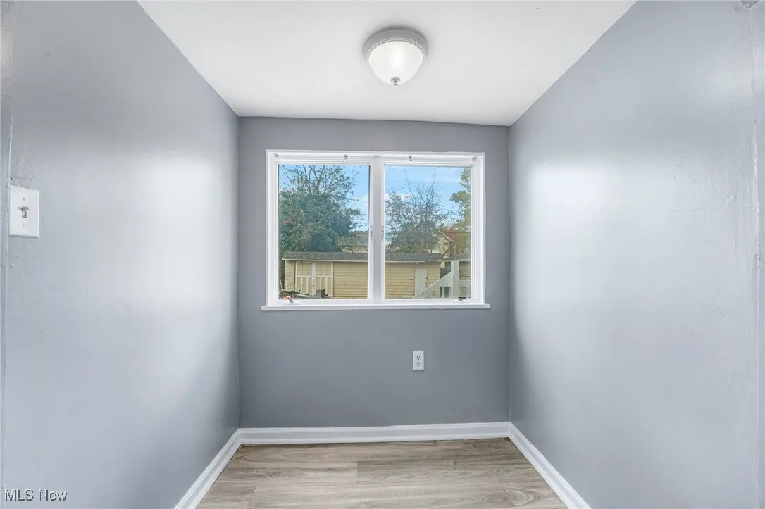Spare room featuring light wood-style floors and​​‌​​​​‌​​‌‌​‌‌​​​‌‌​‌​‌​‌​​​‌​​ baseboards