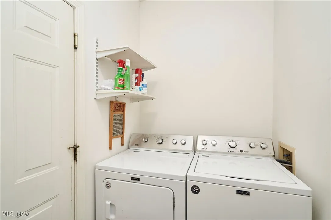 Laundry area featuring washing machine and clothes dryer