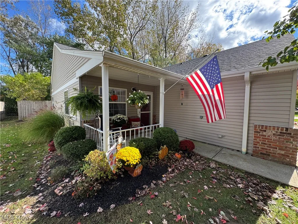 View of front and side elevation and landscaped yard