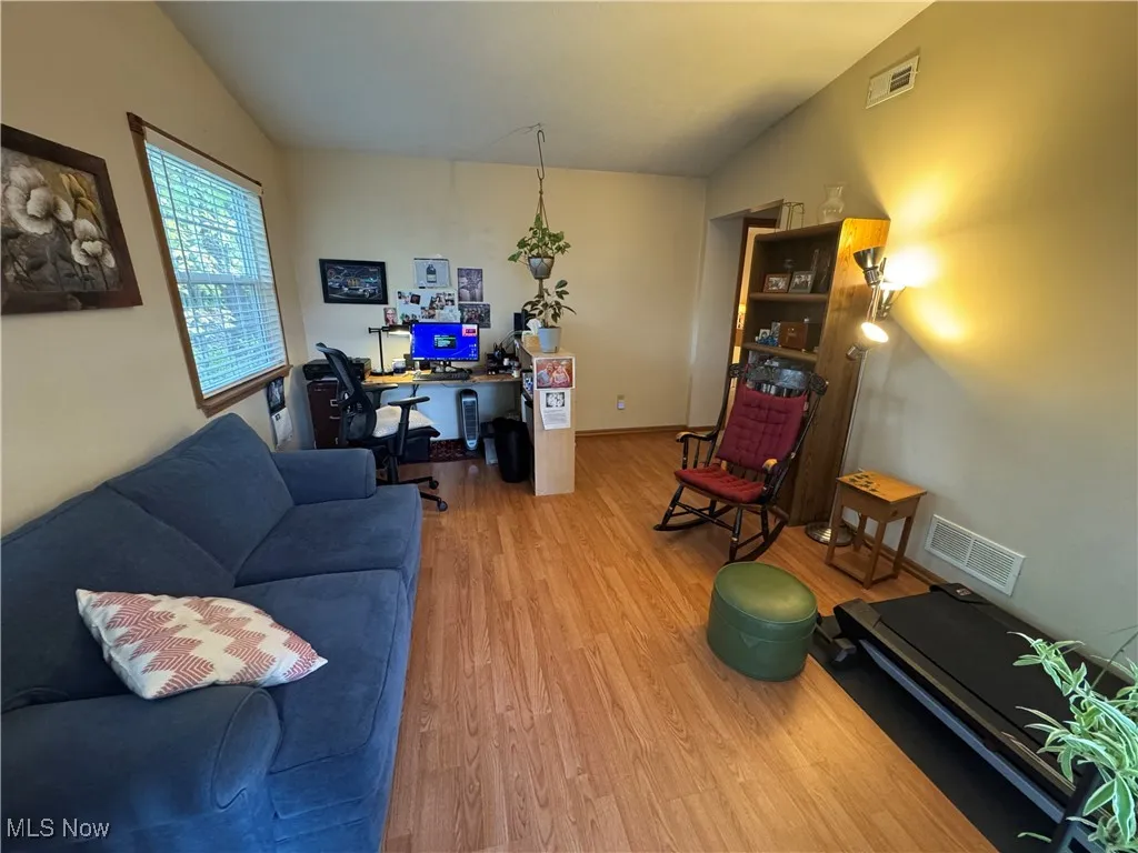 Family room featuring an office area and laminate floors