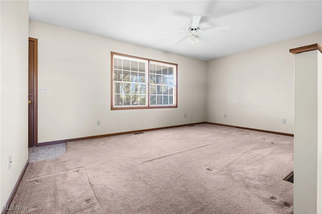 Dining area featuring baseboards and a chandelier