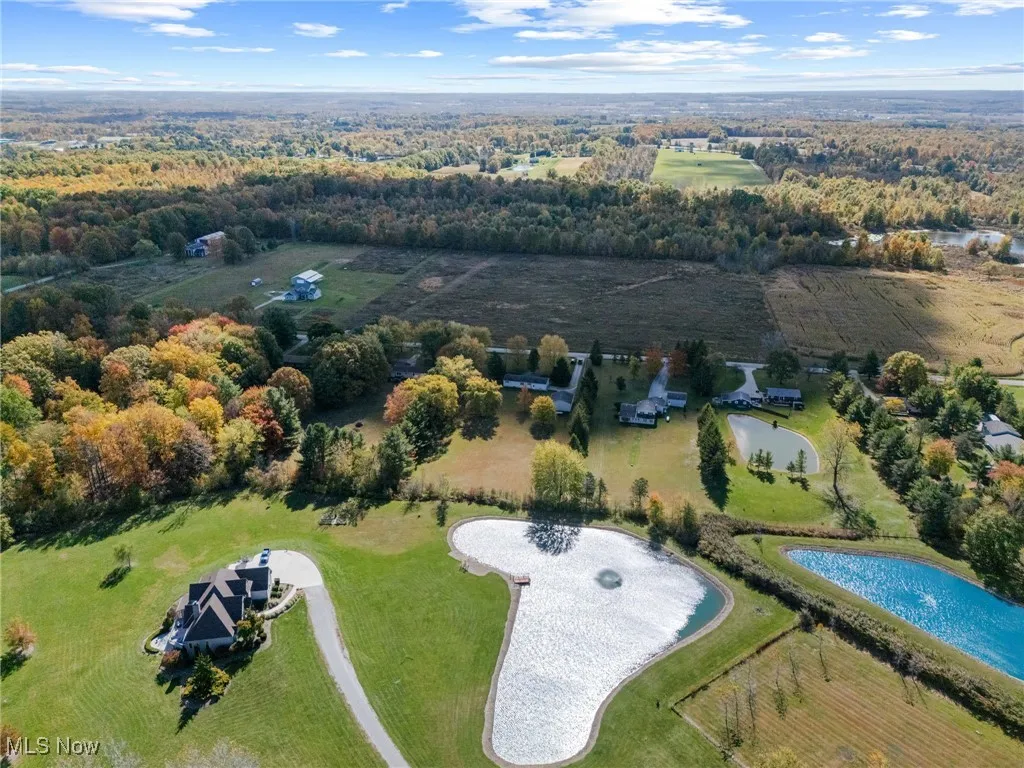 Aerial overview of property's location with a large body of water