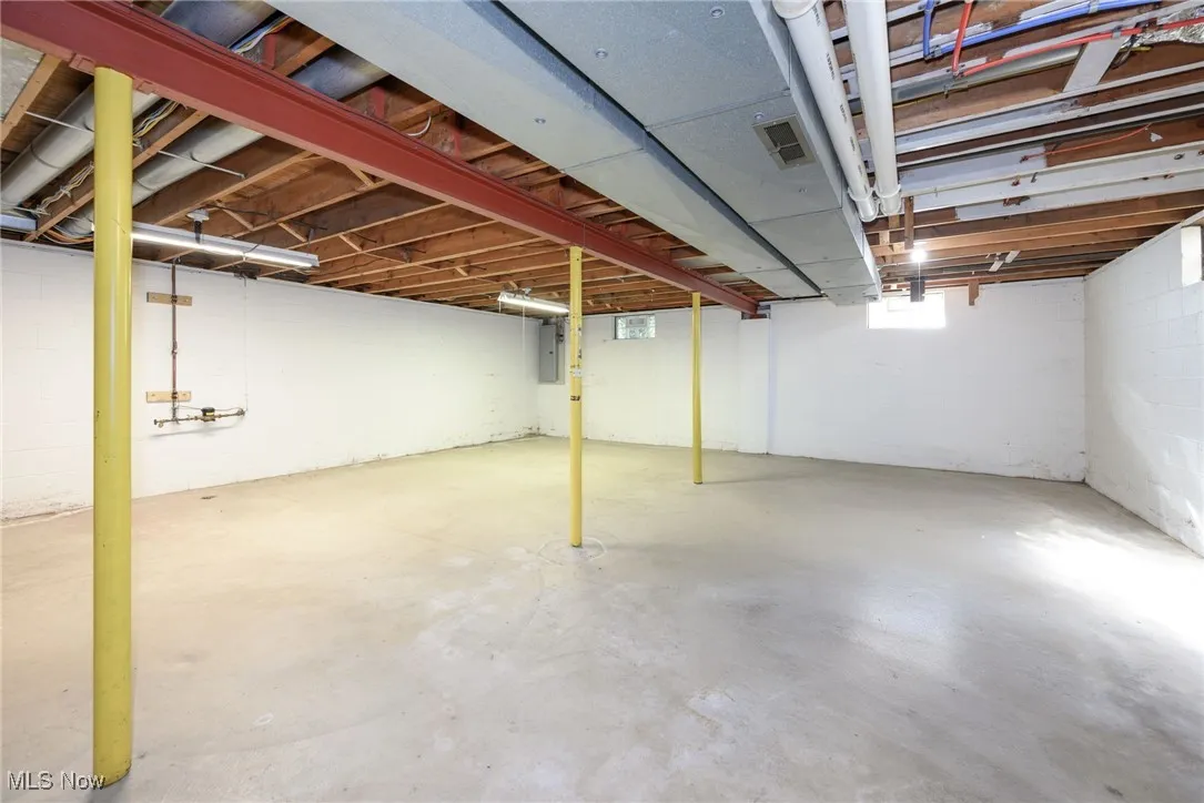 Basement featuring electric panel