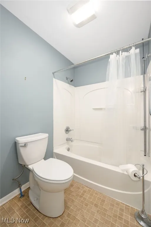 Full bath with shower / bath combo and toilet