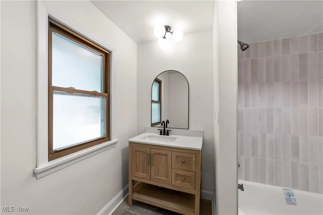 Full bathroom featuring vanity and shower / tub combination