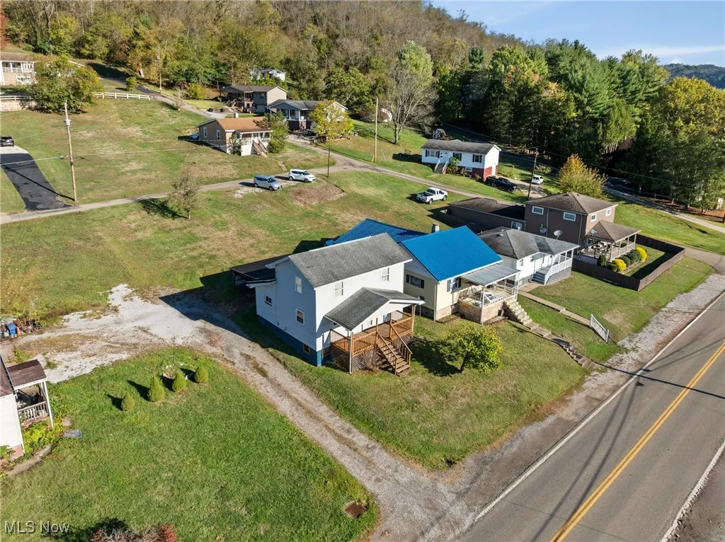 View from above of property with a forest