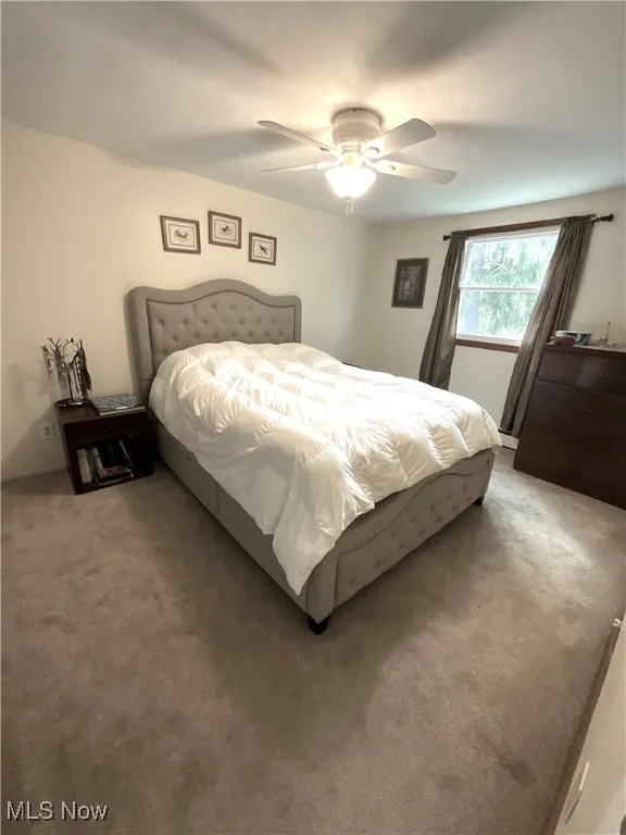 Bedroom featuring carpet floors and a ceiling fan