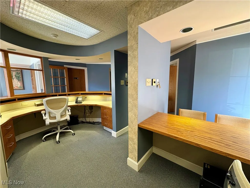 Office area featuring built in study area and recessed lighting
