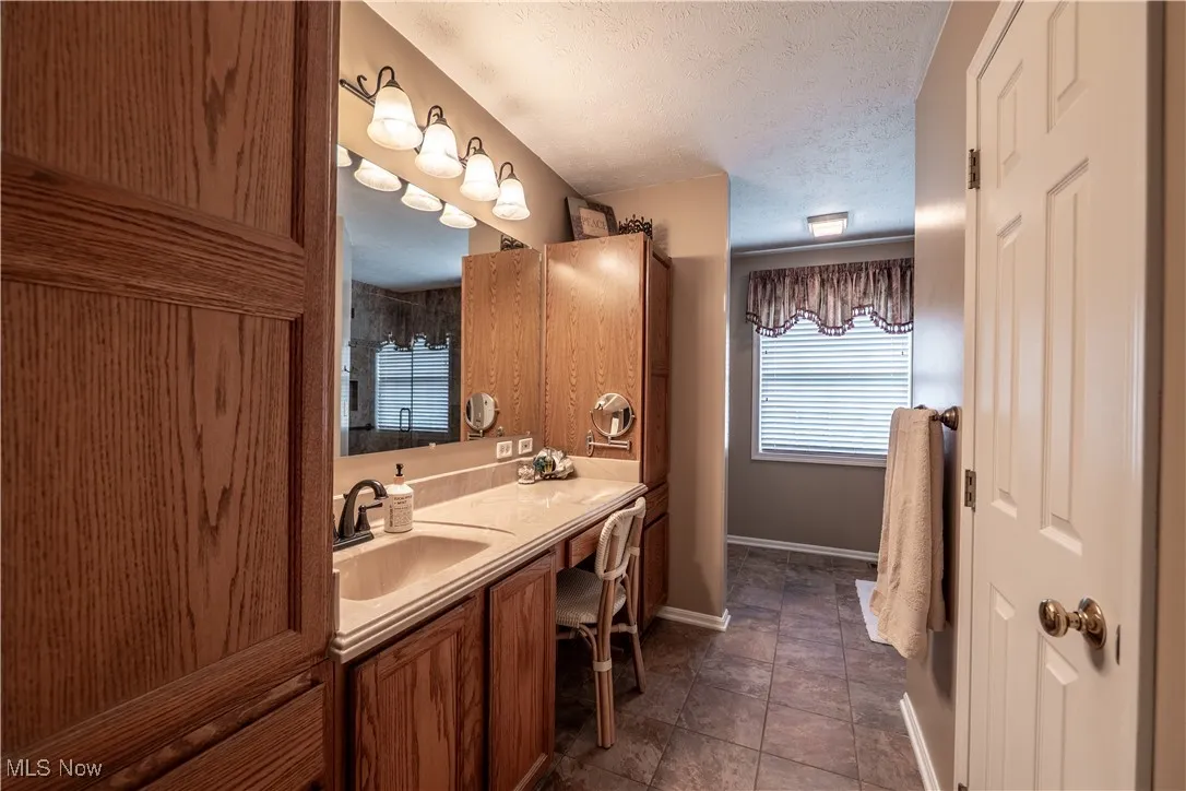 Master Bath with walk-in closet, side storage units and make-up counter