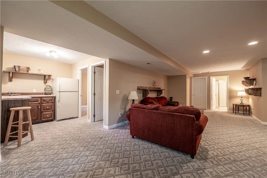 LL Family Room is huge with bar area, storage and refrigerator