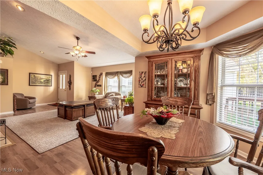 Beautiful dining area with trayed ceiling and bayed windows
