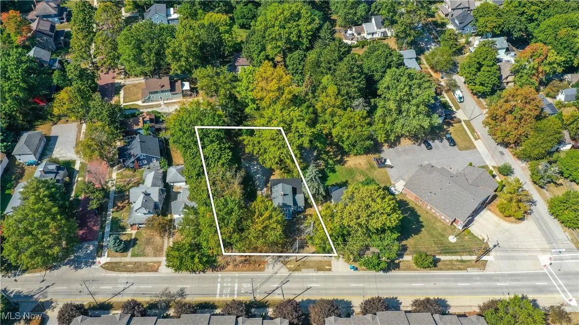 Aerial view of residential area with property boundaries highlighted