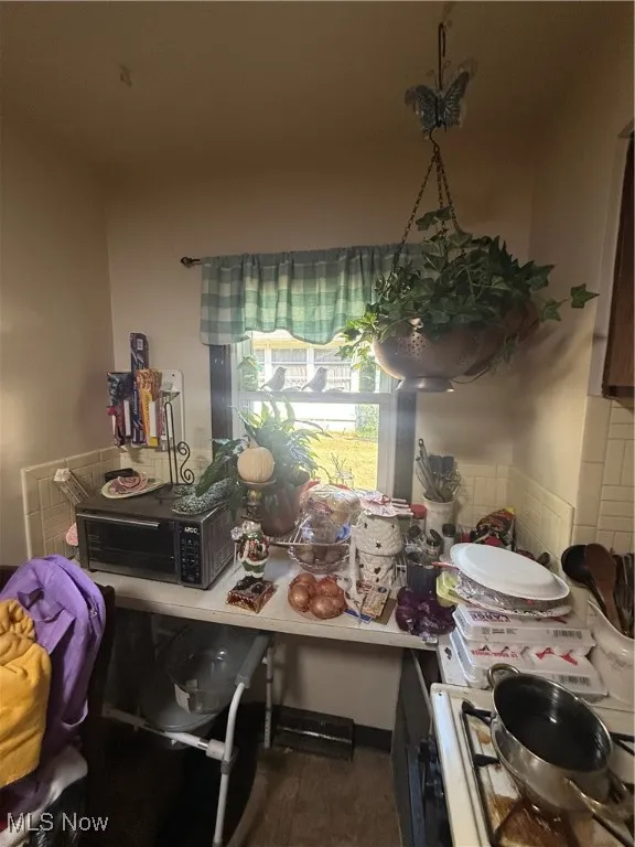 Dining room with dark wood-type flooring