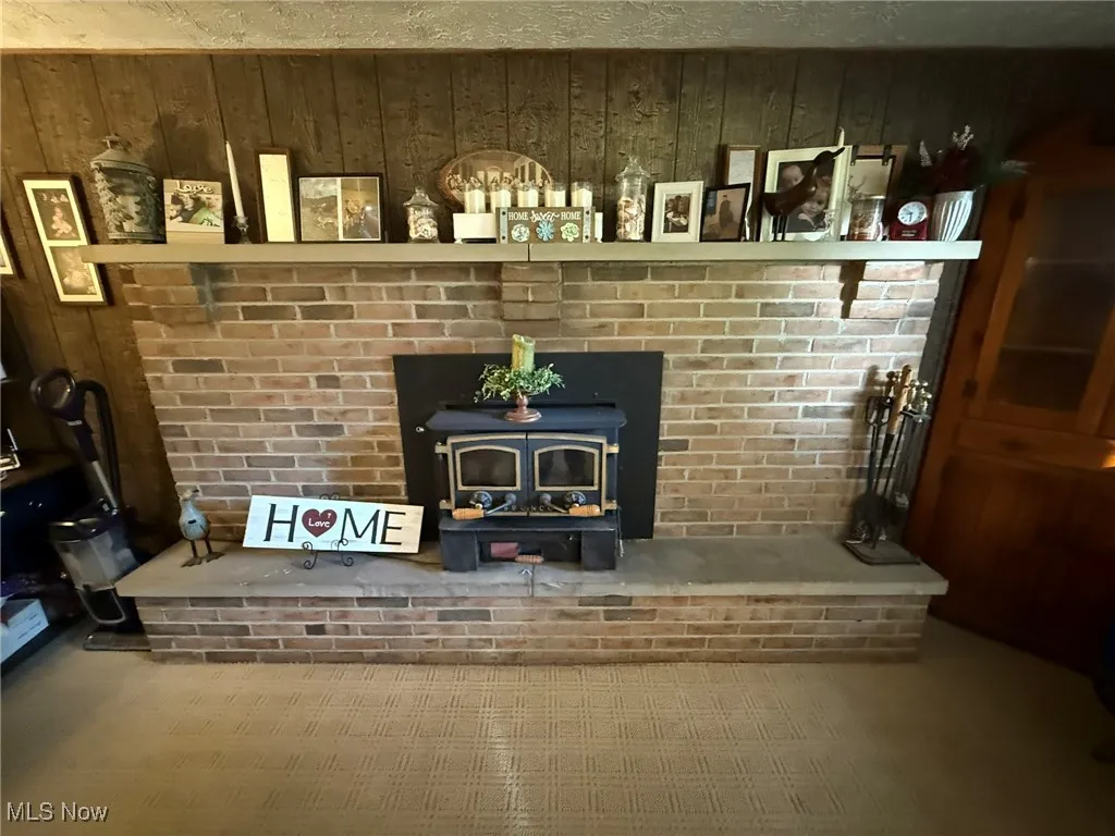 Detailed view of a wood stove and wooden walls