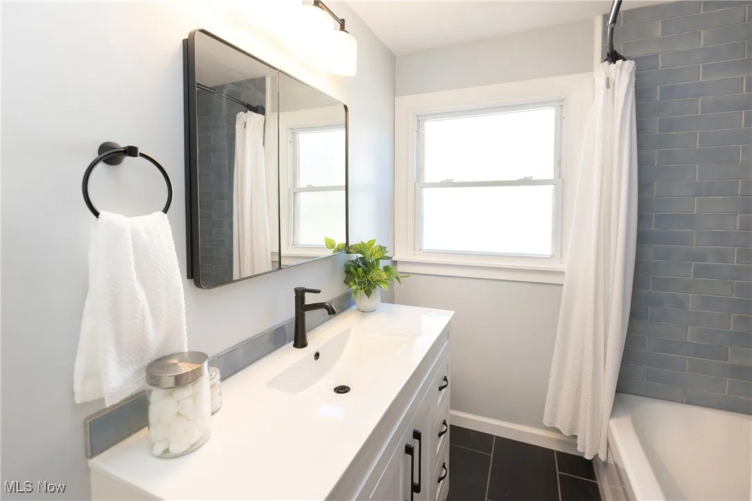 Also, this bathroom offers extra counter space and a medicine cabinet and extra storage!