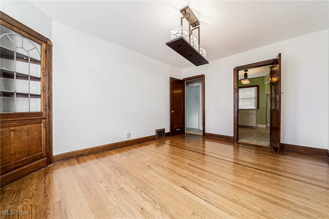 Empty room featuring light wood-type flooring and baseboards