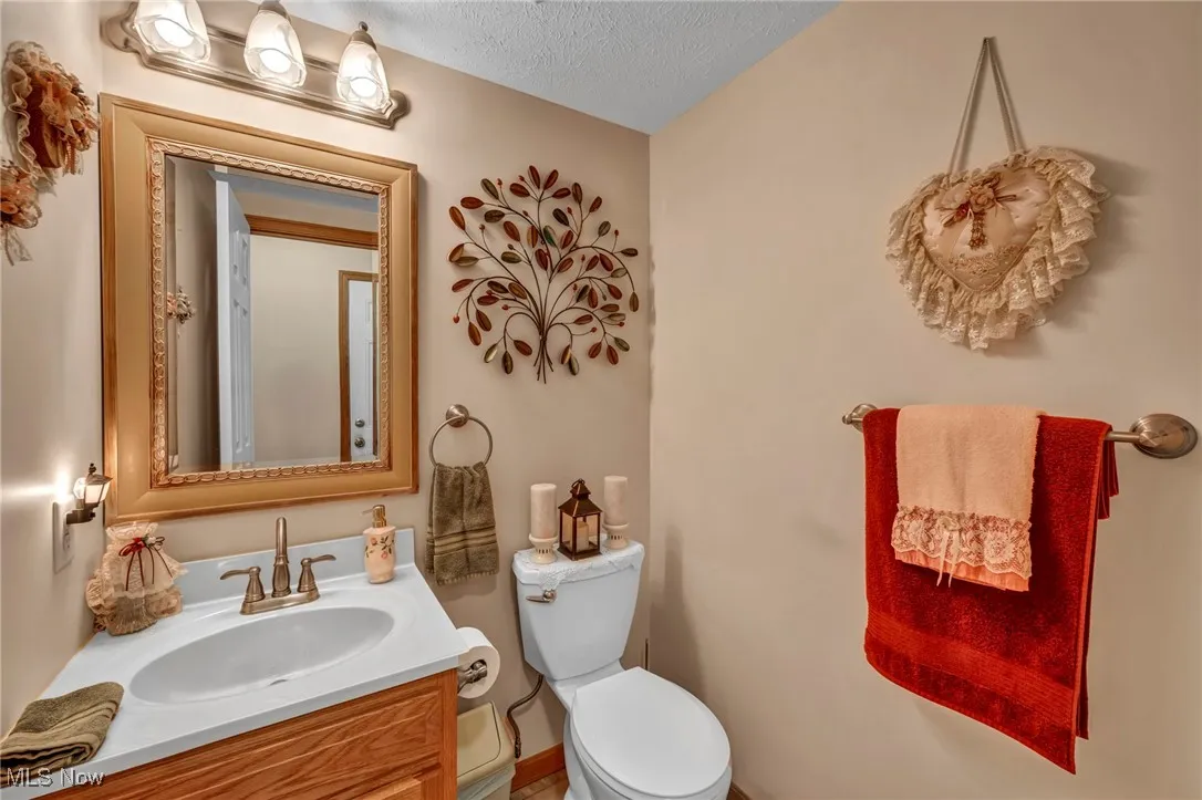 Bathroom featuring vanity and a textured ceiling