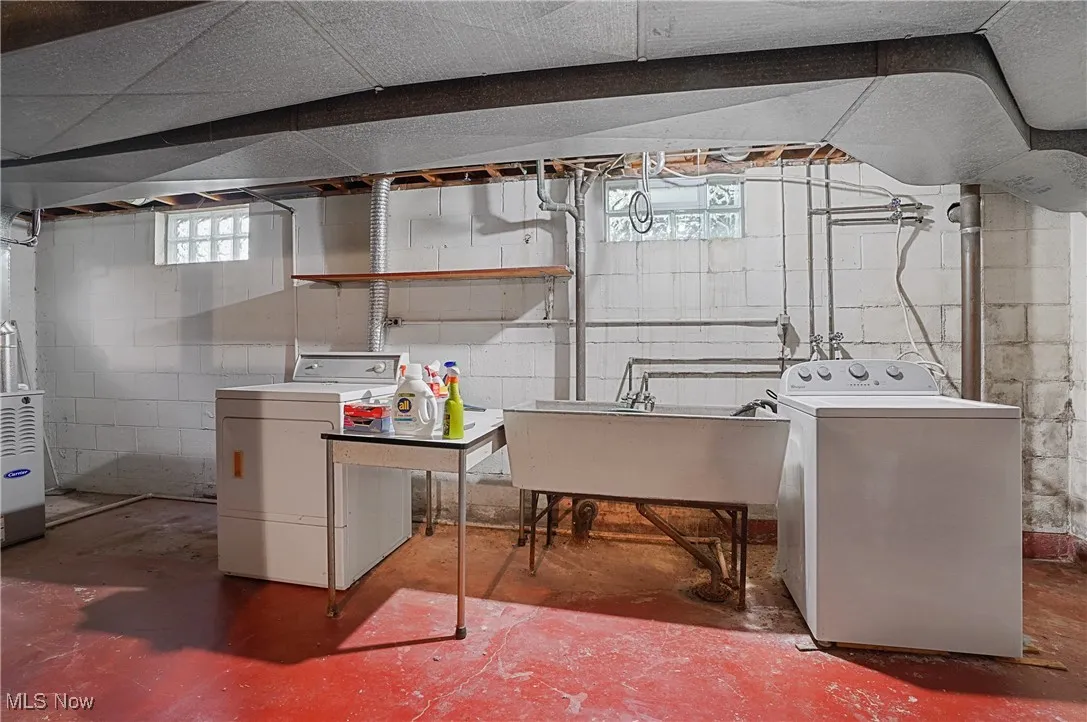 Basement with washer / clothes dryer and heating unit