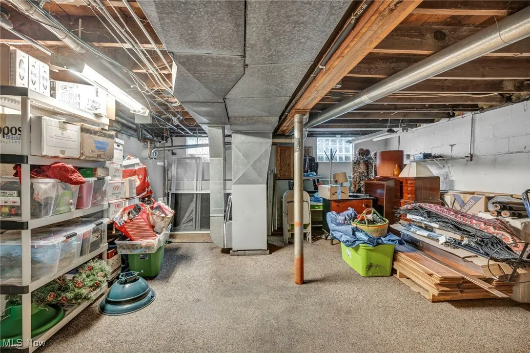 Basement featuring heating unit