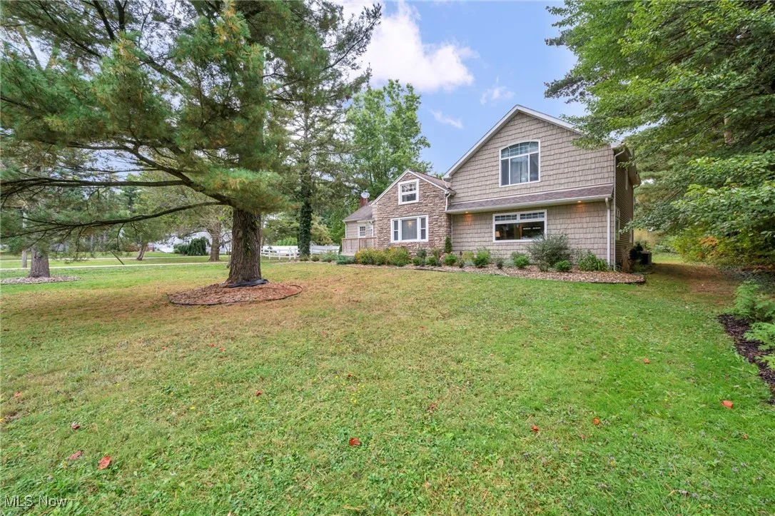 Craftsman inspired home with a front yard