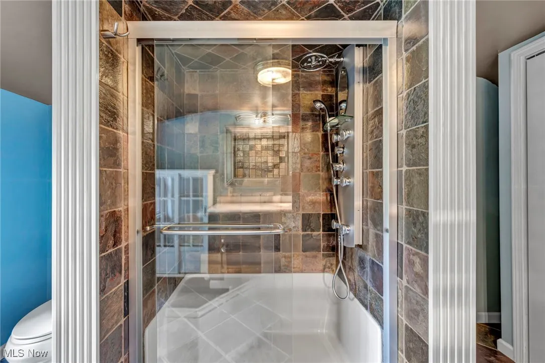 Bathroom second floor featuring a stall shower and toilet