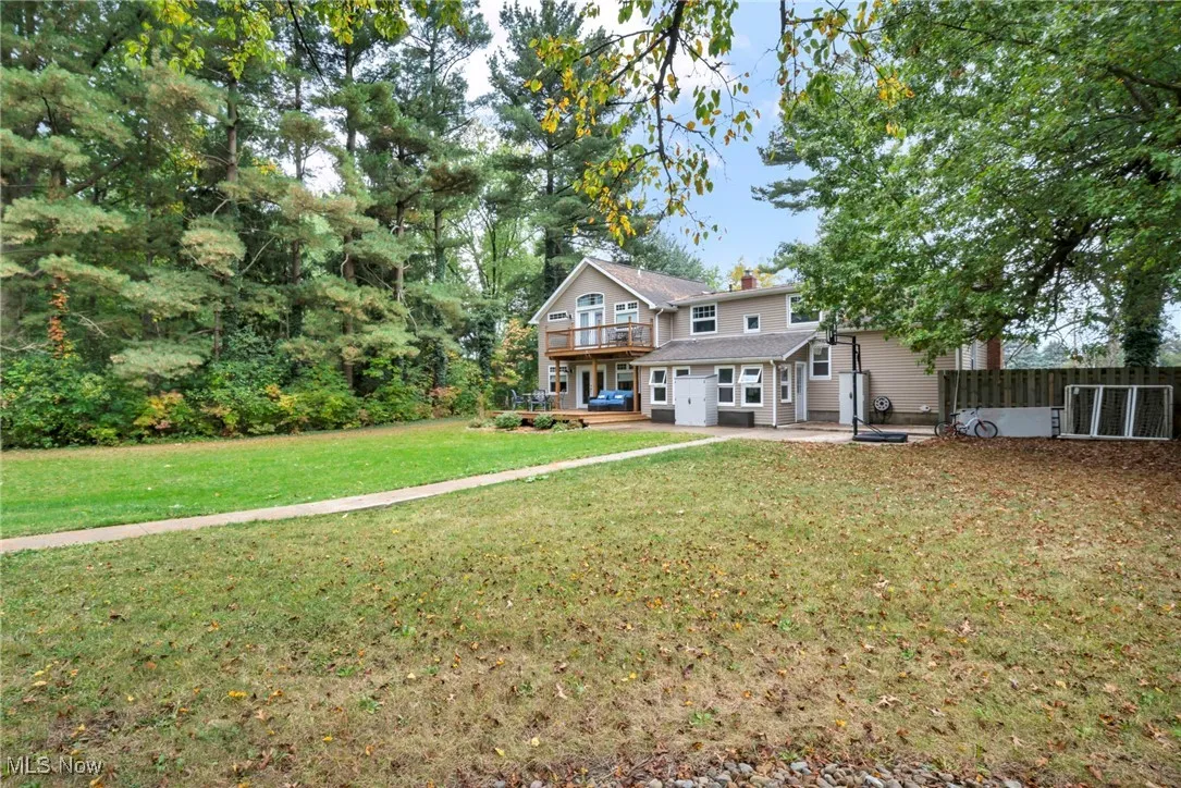Rear view of property featuring a chimney