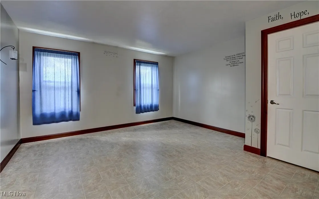 Spare room with baseboards