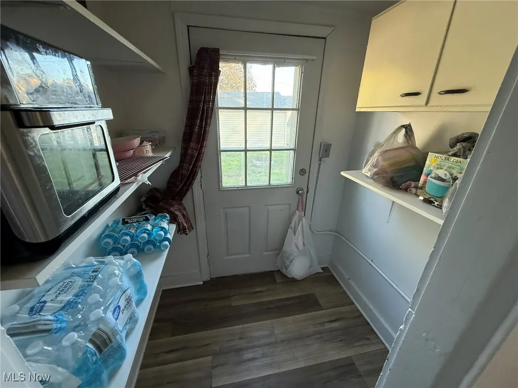 Doorway to outside featuring wood finished floors