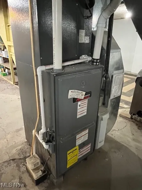 Utility room featuring heating unit