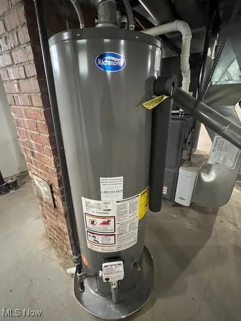 Utility room with water heater and heating unit