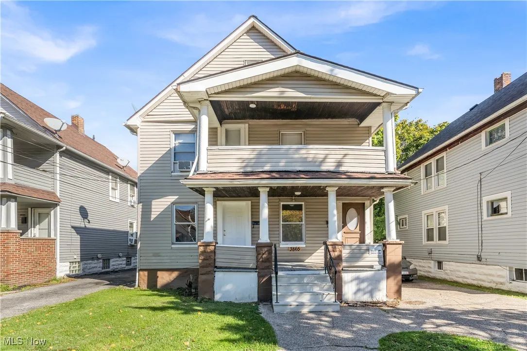 View of front of home featuring a porch and a front lawn