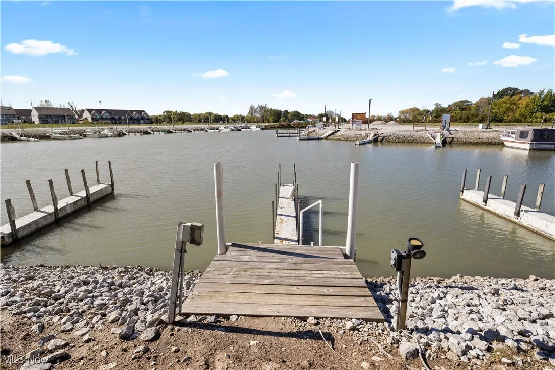 Dock area featuring a water view