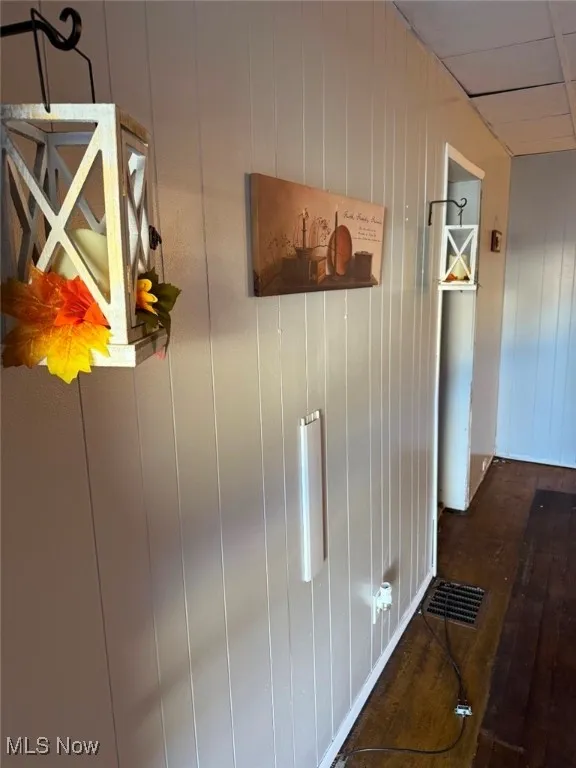 Detailed view of wood finished floors and wood walls