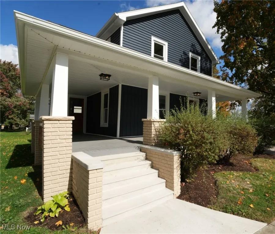 View of front of home featuring new steps and wrap around covered porch