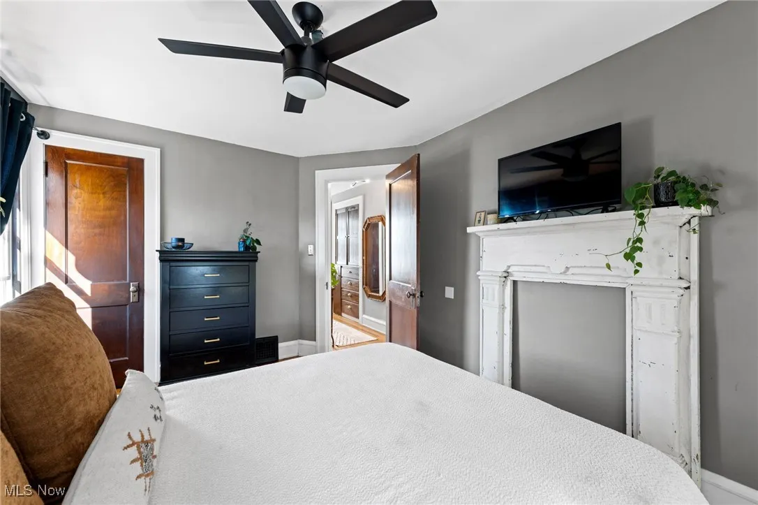 Bedroom with baseboards and a ceiling fan