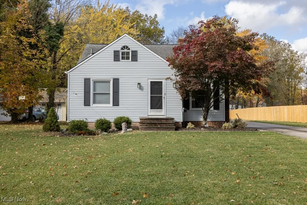 View of front of property with roof with shingles