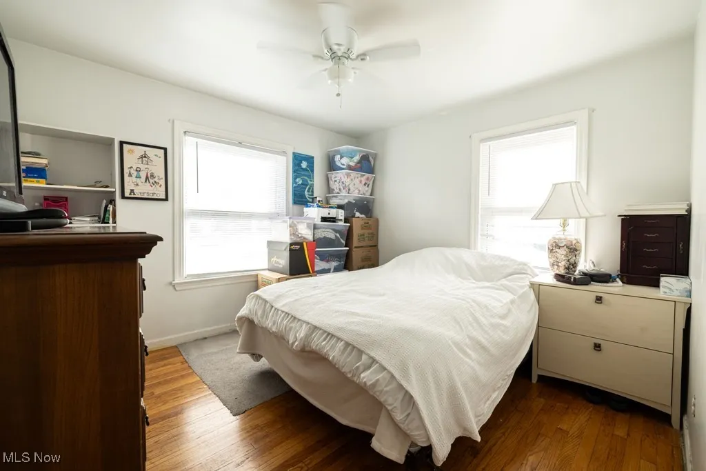 Bedroom featuring wood finished floors and ceiling fan