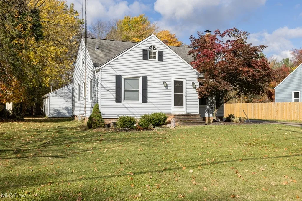 View of front of property with a shingled roof