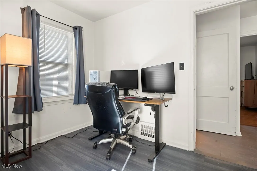 Office featuring dark wood-style floors