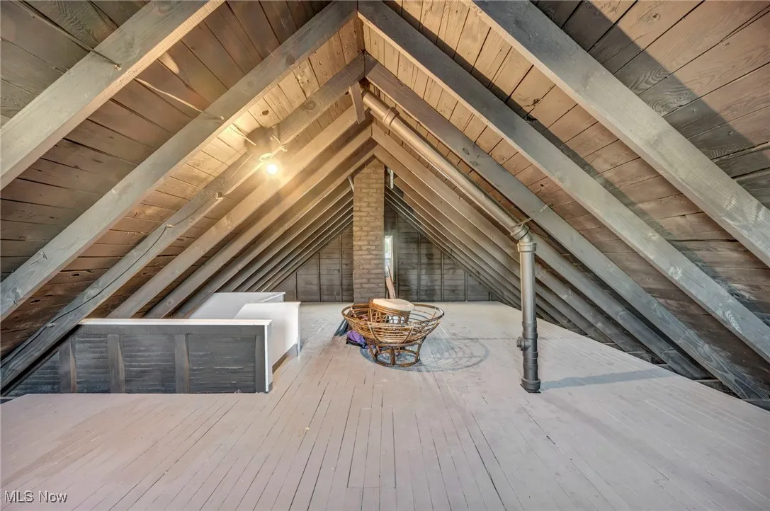 Attic featuring an upstairs landing