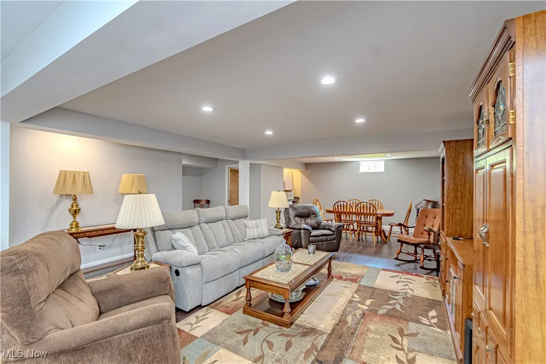 Living area with recessed lighting and wood finished floors