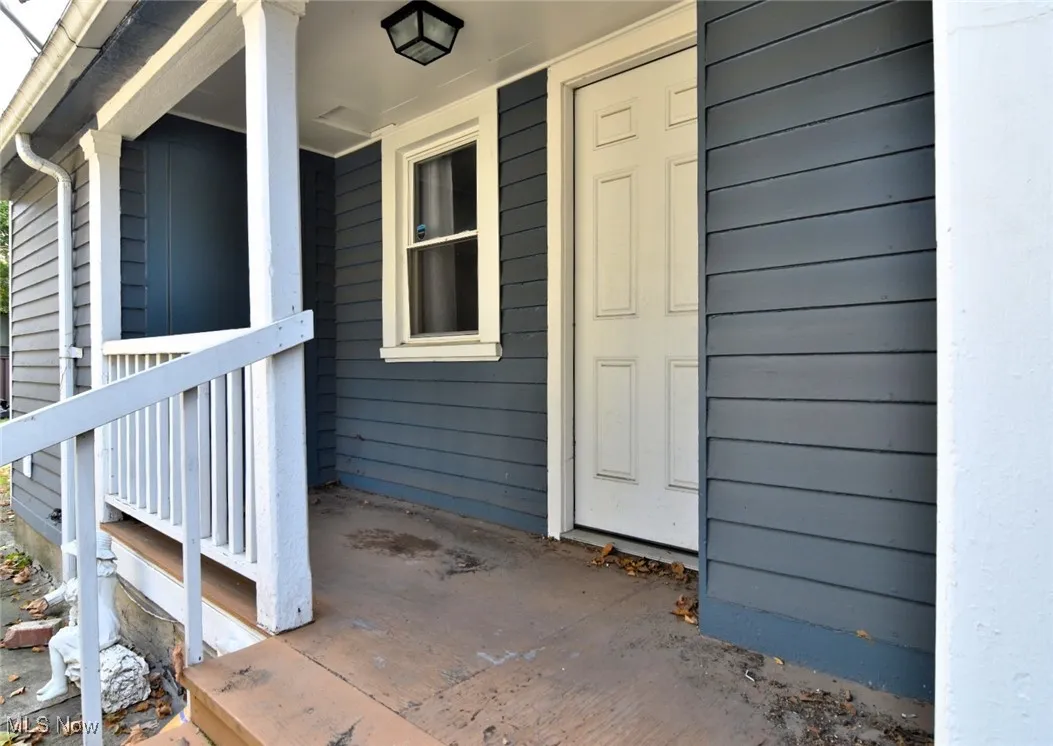 Property entrance with a porch